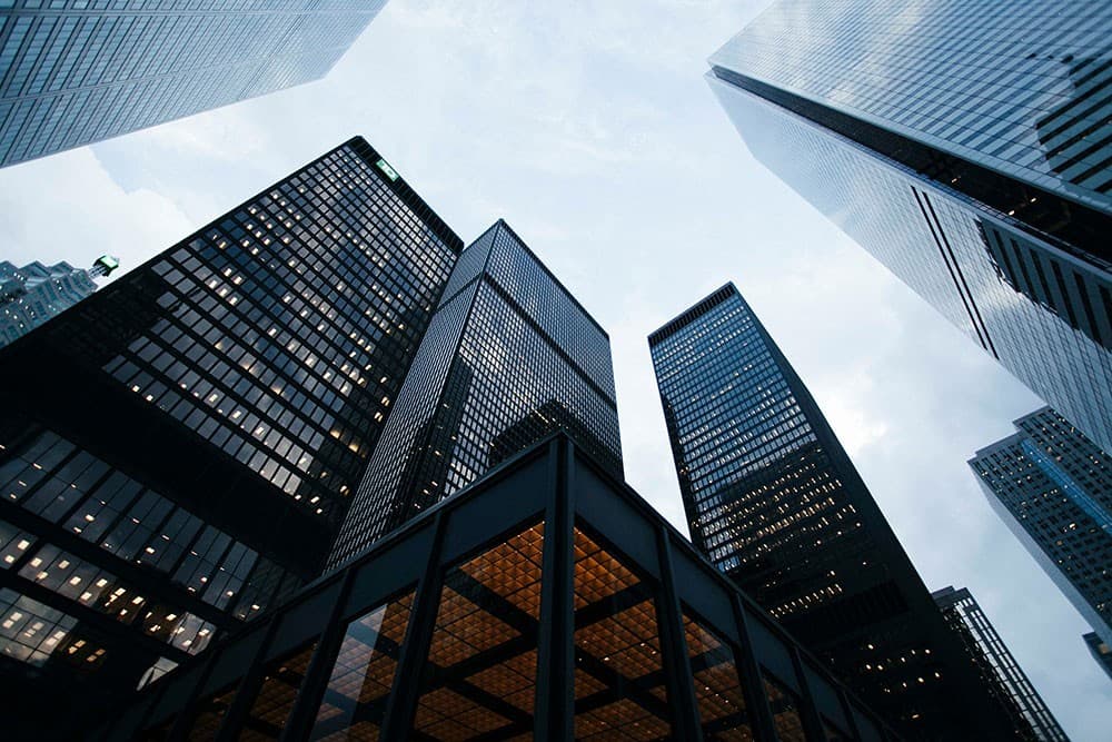 Glass office towers representing a financial district